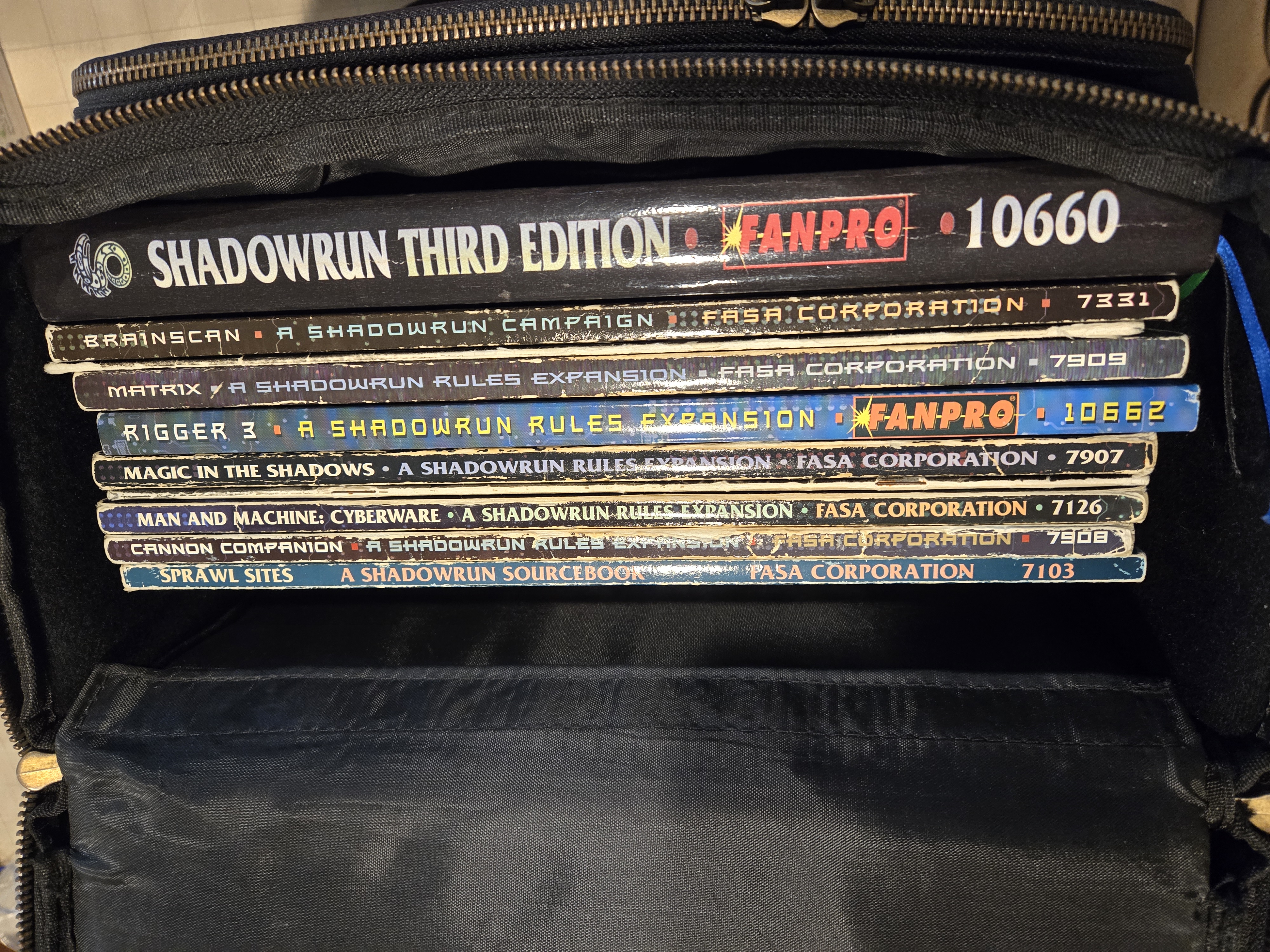 Several Shadowrun books in the case itself